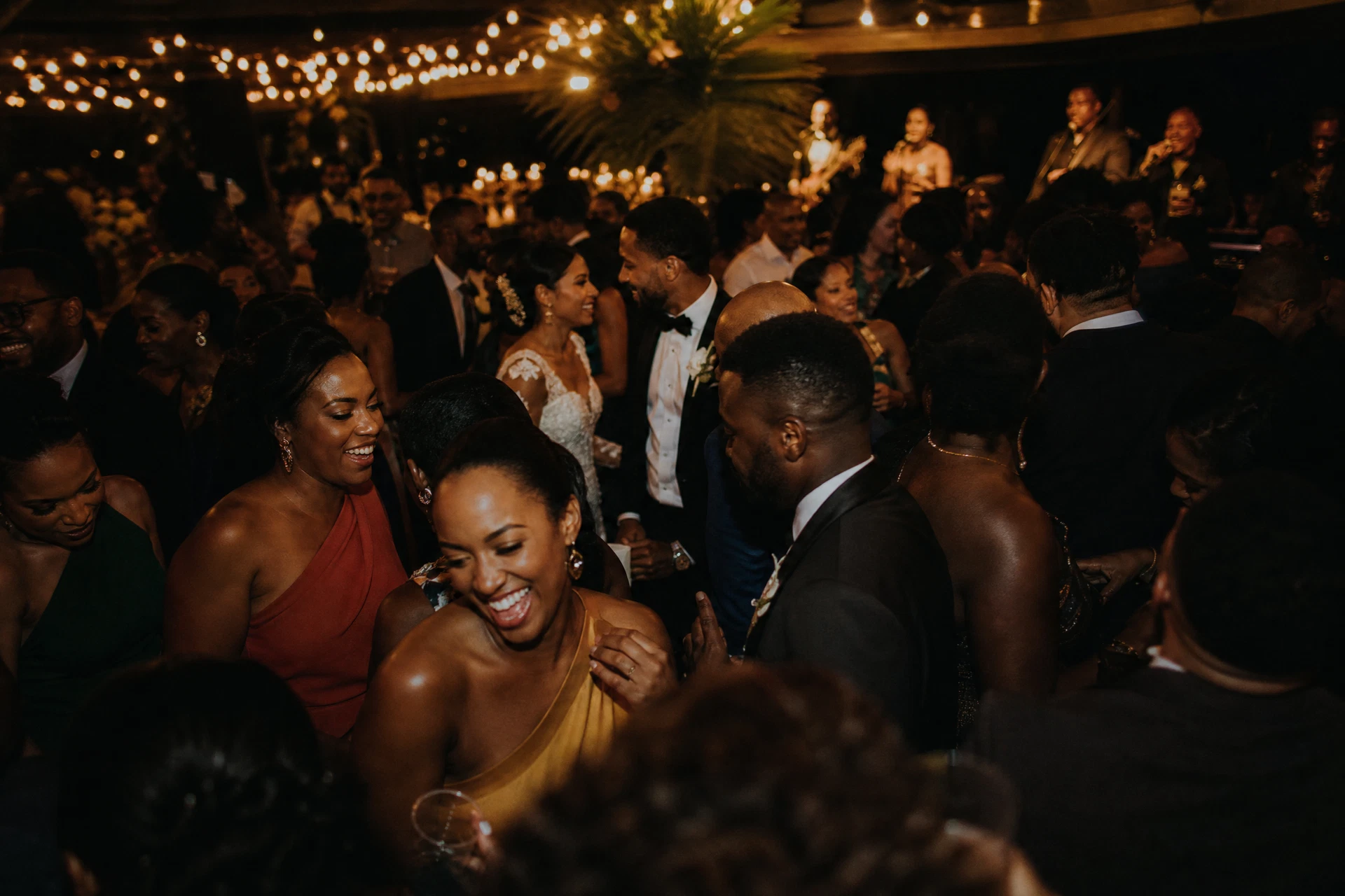 Wedding guests celebrating at a reception